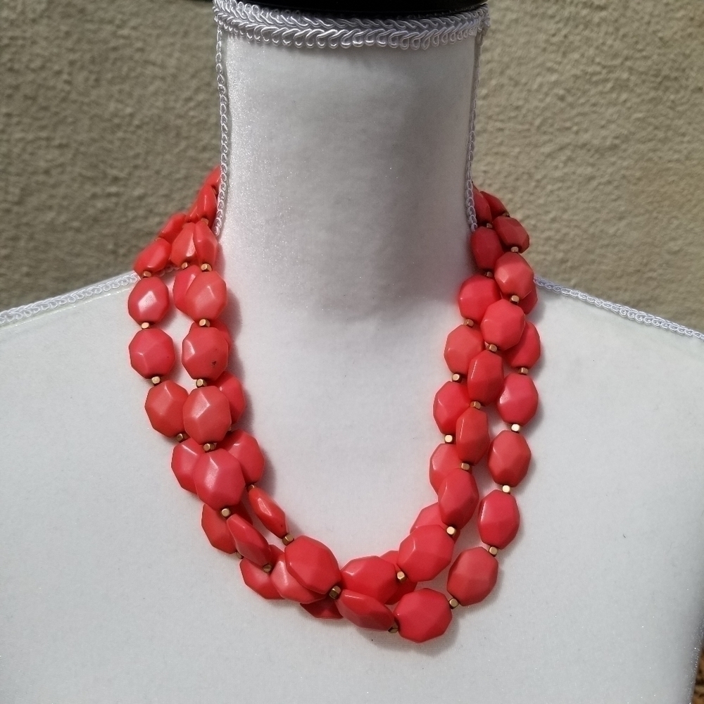 layered coral pink acrylic beaded necklace with gold tone separators
